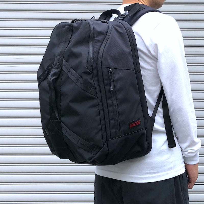 -〔UNISEX〕- WHITE MOUNTAINEERING BLK ホワイトマウンテニアリング 　　 WM × BRIEFING BACK  PACK